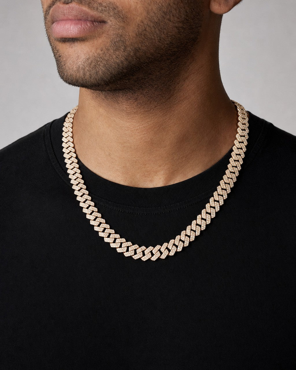 Male model wearing 14k 12.4mm Two Tone Baguette Diamond Cuban Chain 20”