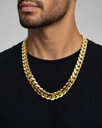 Male model wearing 14K Cuban Link Chain 18MM 22"