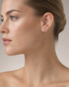 Female model wearing 10K Circle Castle Diamond Earrings
