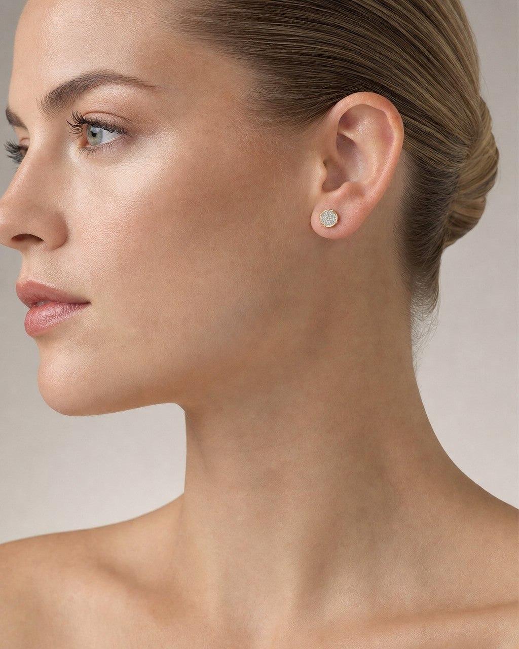 Female model wearing 10K Circle Castle Diamond Earrings