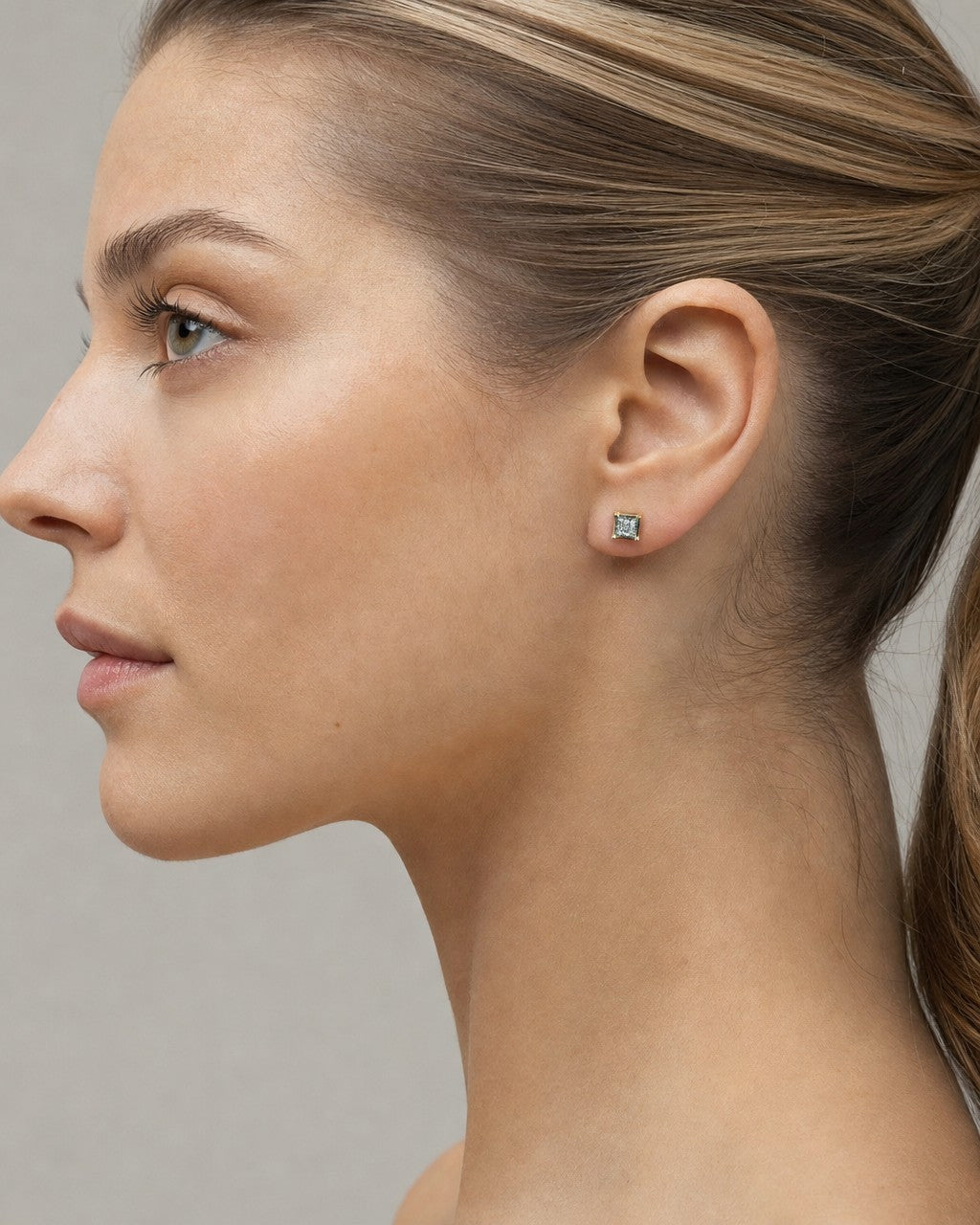 Female model wearing 10k Castle Flat studded earring