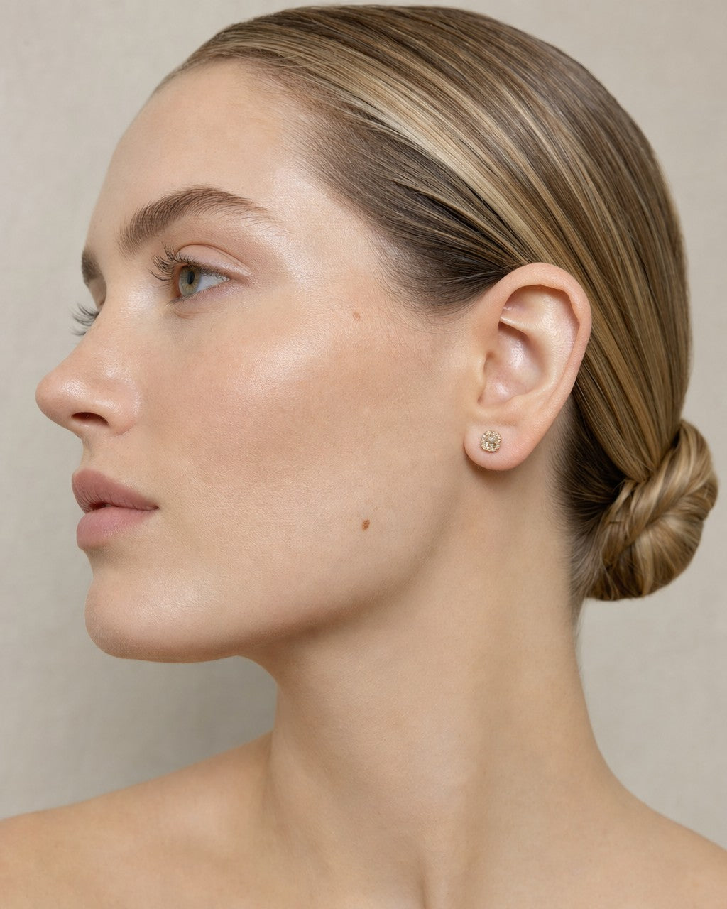 Female model wearing 10k Square Rounded Diamond Baguette Rows Earrings