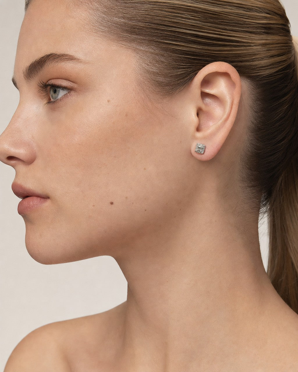 Female model wearing 10k Square Box Diamond Baguette Earrings