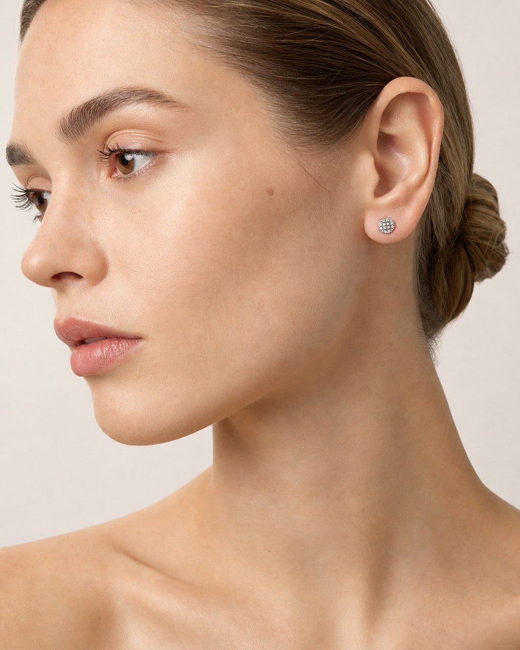 Female model wearing 10k Pancake Diamond Studded Earring