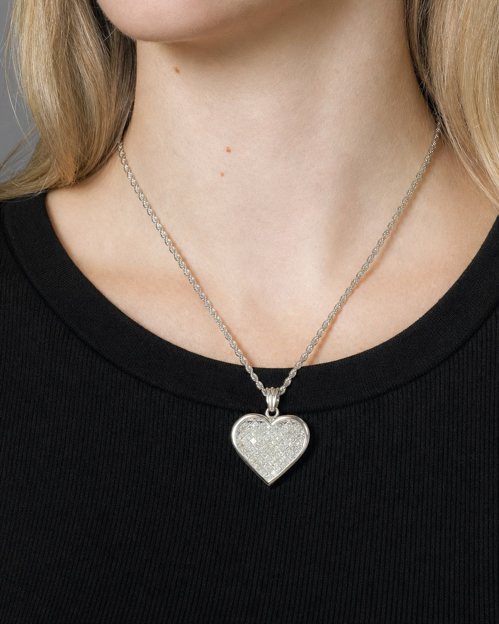 Female model wearing 14k Heart Pendant with Chain
