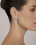 Female model wearing 14k Bridal El Trebol Baguette Hanging Earrings