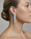 Female model wearing 14K Bridal Gardenia Baguette Hanging Earrings