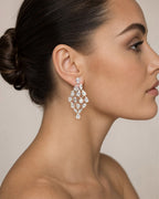Female model wearing 14K Bridal Baguette Web Earrings