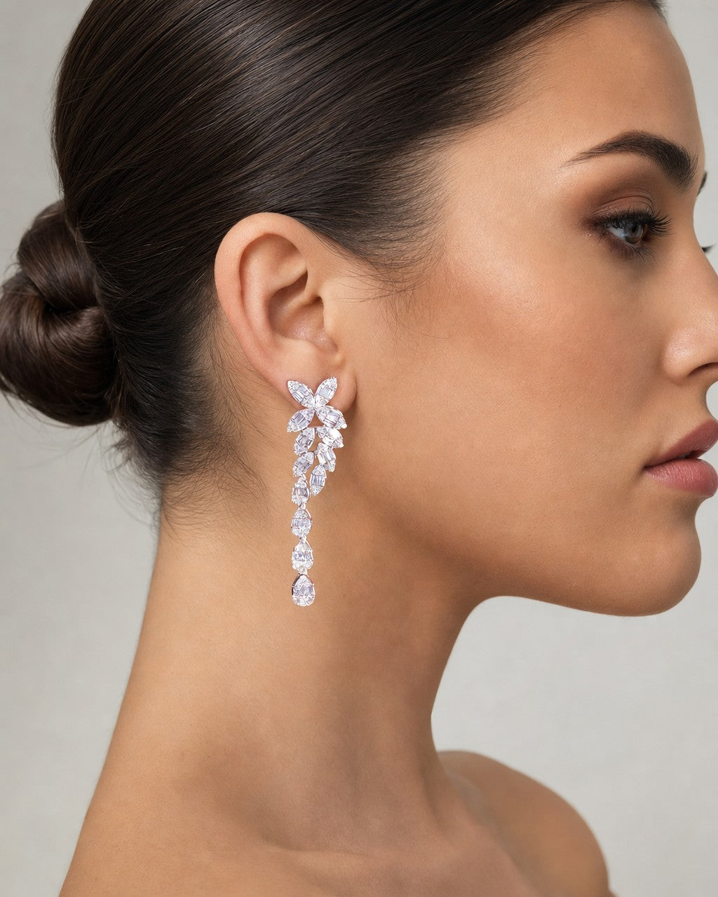 Female model wearing 14K Bridal Flower Baguette Hanging Earrings