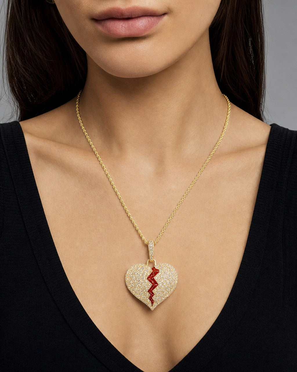 Female model wearing 14K Broken Heart Diamond Pendant