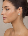 Female model wearing 14K Round Diamond Stud Earrings