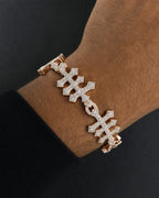 Male model wearing 10k Triple Infinity Cross Bracelet