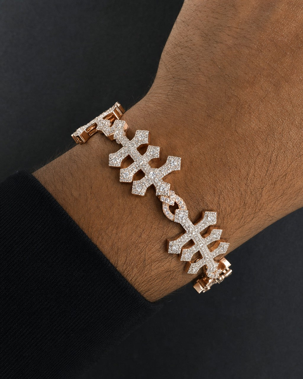 Male model wearing 10k Triple Infinity Cross Bracelet