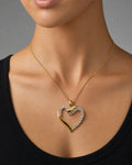 Female model wearing 10K Gold & Diamond Heart Pendant