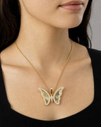 Female model wearing 14K Butterfly Shine Diamond Pendant
