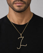 Male model wearing 14K Small Initial Letter Script Diamond Pendant Full Collection