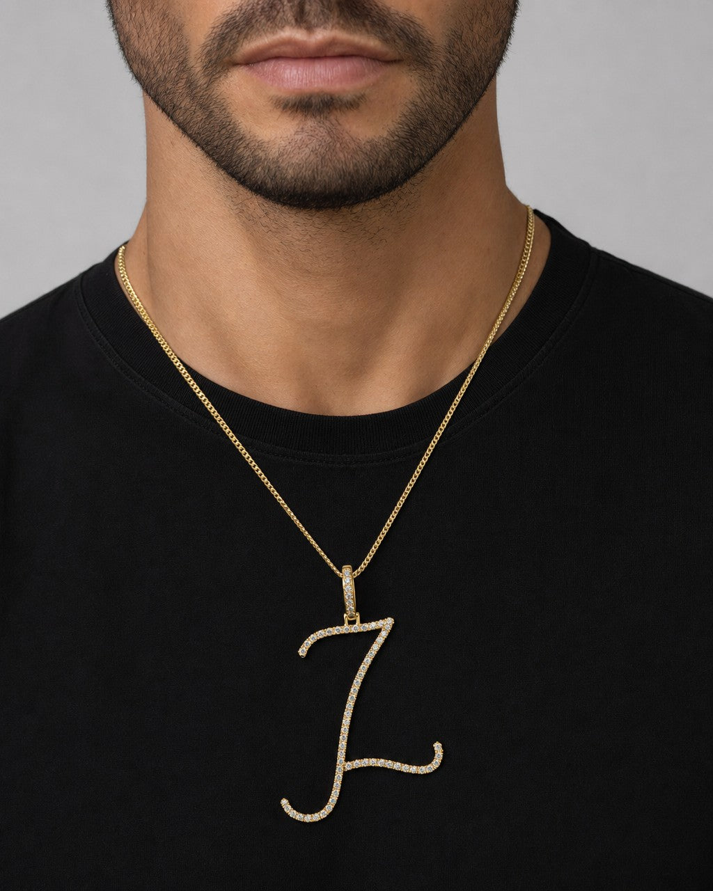 Male model wearing 14K Small Initial Letter Script Diamond Pendant Full Collection