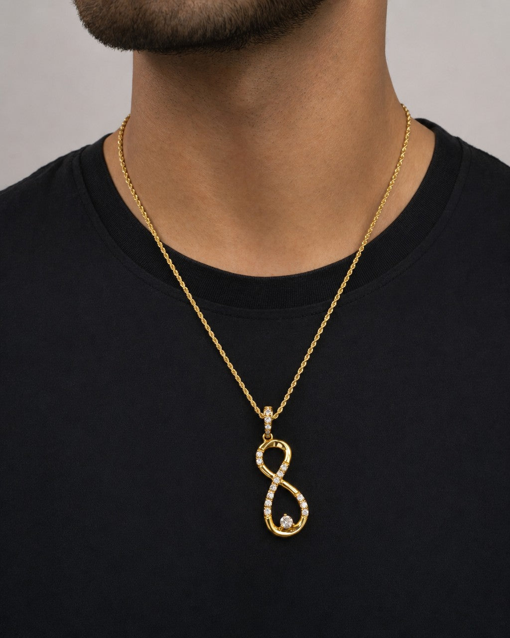Male model wearing 10K Diamond Infinity Pendant