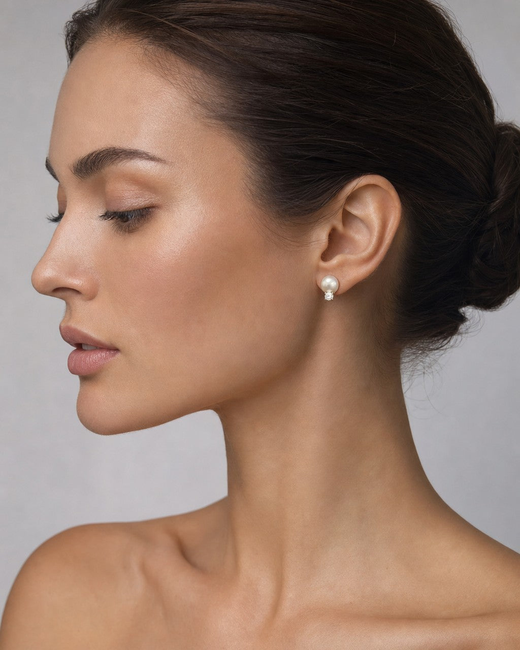 Female model wearing 18K Vintage Tiffany & Co Pearl Stud