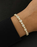 Male model wearing 10K 5.5MM Square Circle Link Diamond Baguette Tennis Bracelet 7"