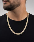 Male model wearing 10K 6.3MM Rectangle Diamond Baguette Tennis Chain 20"
