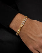 Male model wearing 14K Two-Tone Flat Cuban Link Bracelet