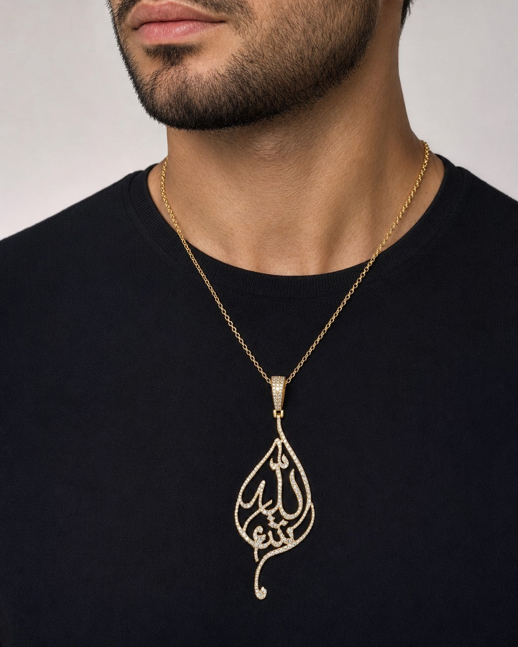 Male model wearing 14K Allah Leaf Diamond Pendant