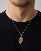 Male model wearing 14K Lace Hamsa Pendant