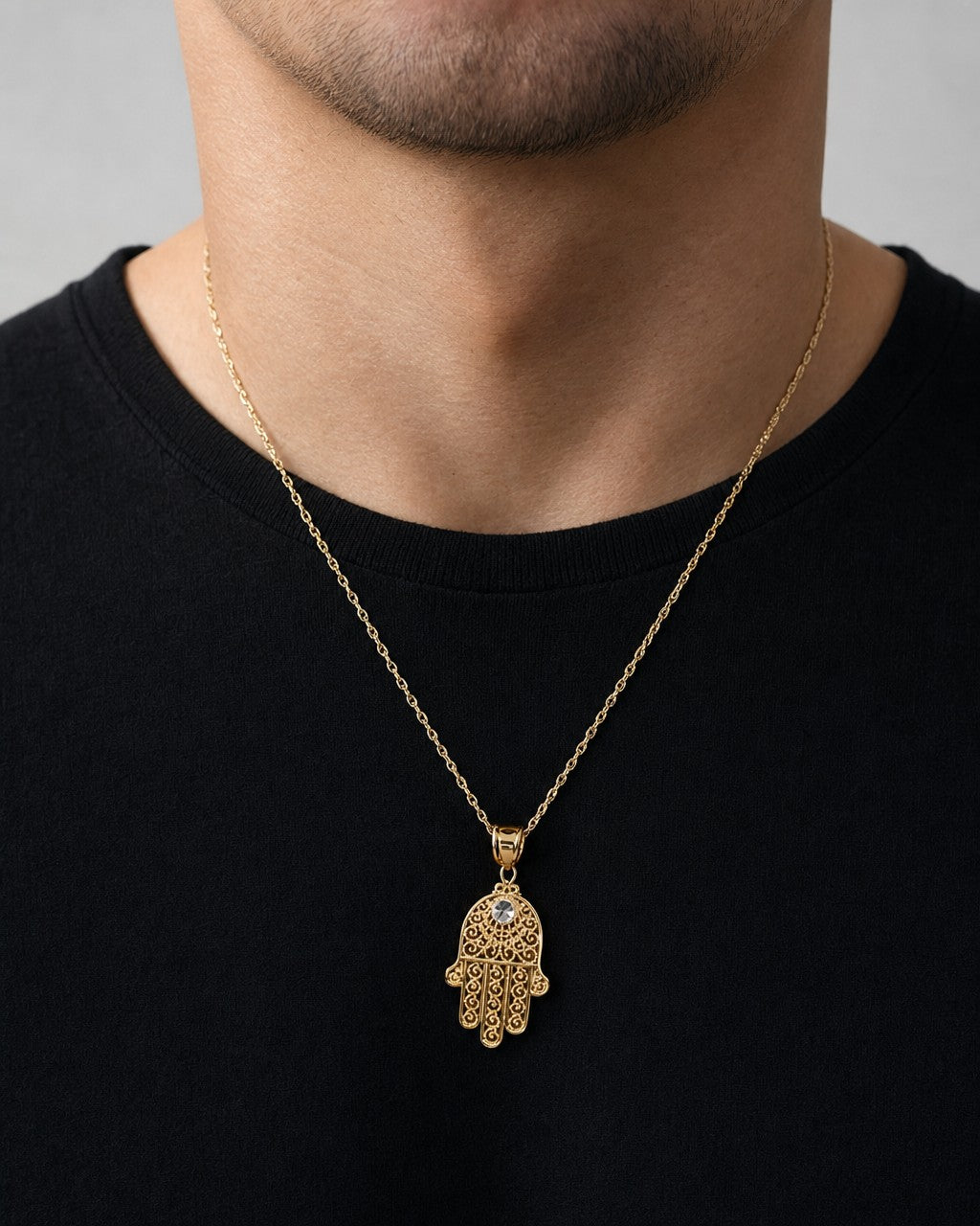 Male model wearing 14K Lace Hamsa Pendant