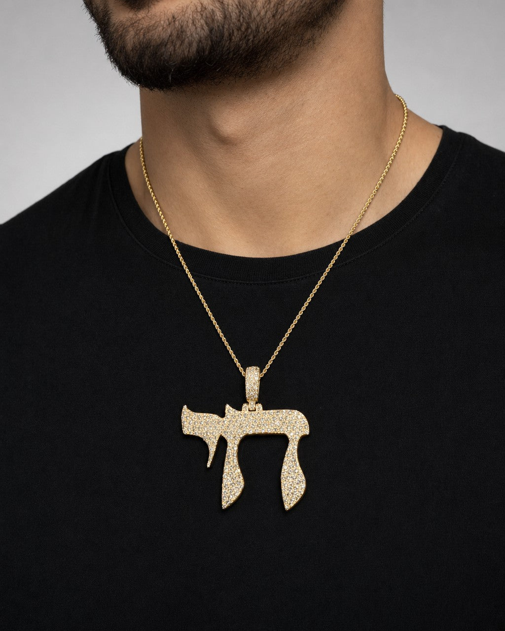 Male model wearing 14K Chai Diamond Pendant