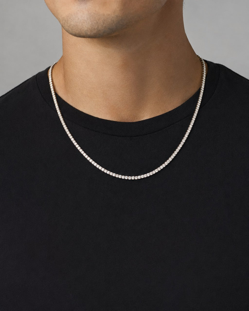 Male model wearing 10K 2.9MM Diamond Tennis Chain Necklace 16"