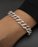 Male model wearing 10K Iced Infinity Cuban Link Diamond Bracelet