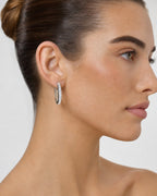 Female model wearing 14K Kendal Diamond Baguette Hoop Earrings
