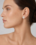 Female model wearing 14K 8MM Gaia Circle Diamond Earrings