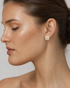 Female model wearing 14K 8MM Marcia Rounded Square Diamond Earrings