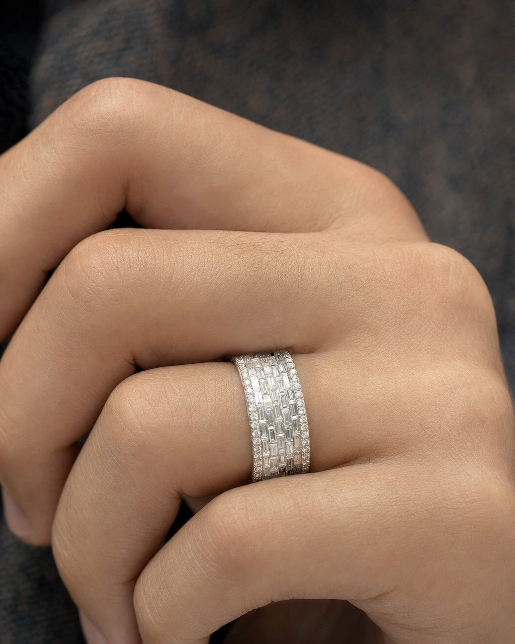 Male model wearing 14K 8MM Iced Infinity Diamond Baguette Ring