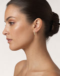 Female model wearing 14K Pavé Hoop Diamond Earrings
