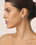Female model wearing 14K 8.3MM Circle Diamond Baguette Earrings