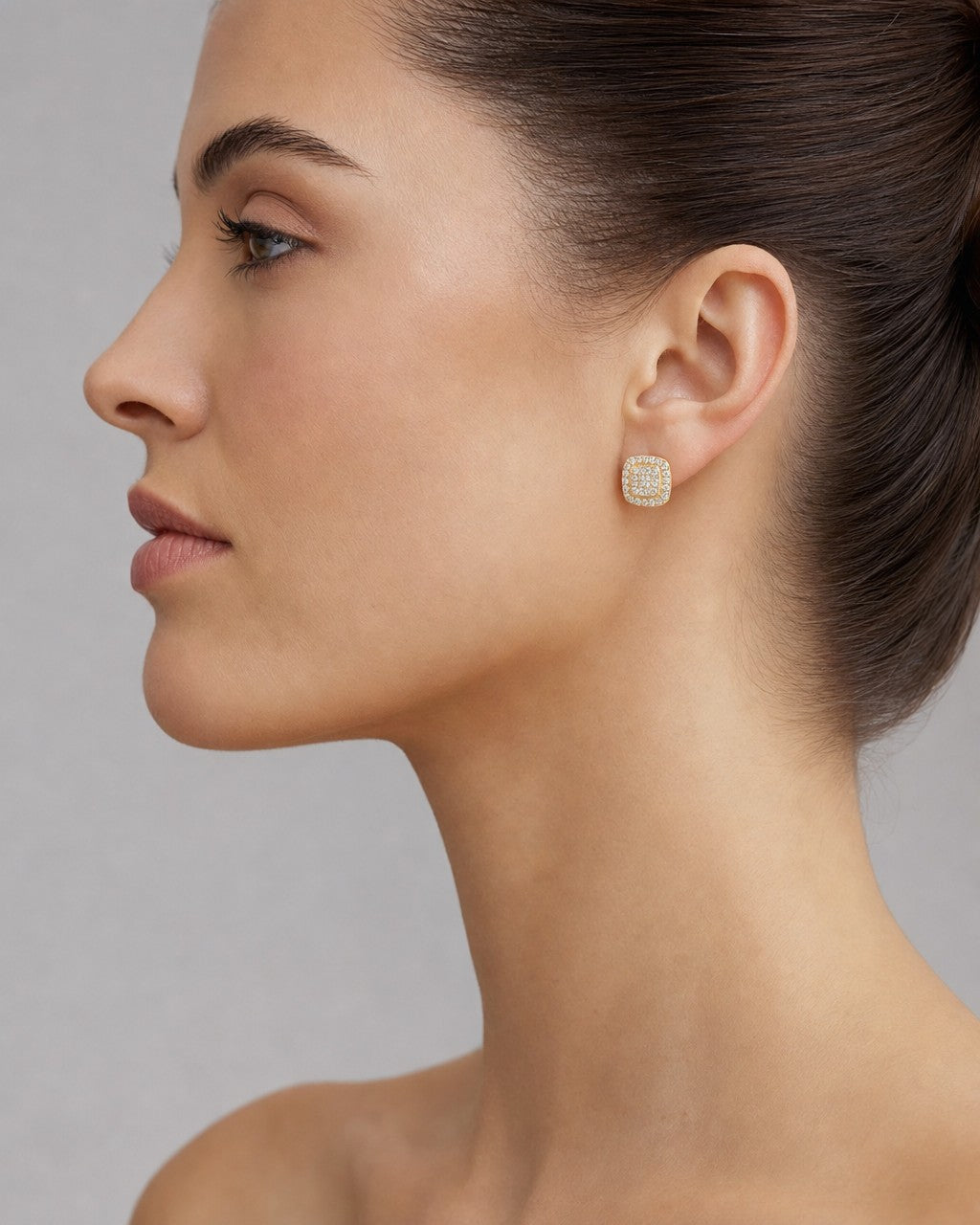 Female model wearing 14K 7.9MM Rounded Square Halo Diamond Earrings