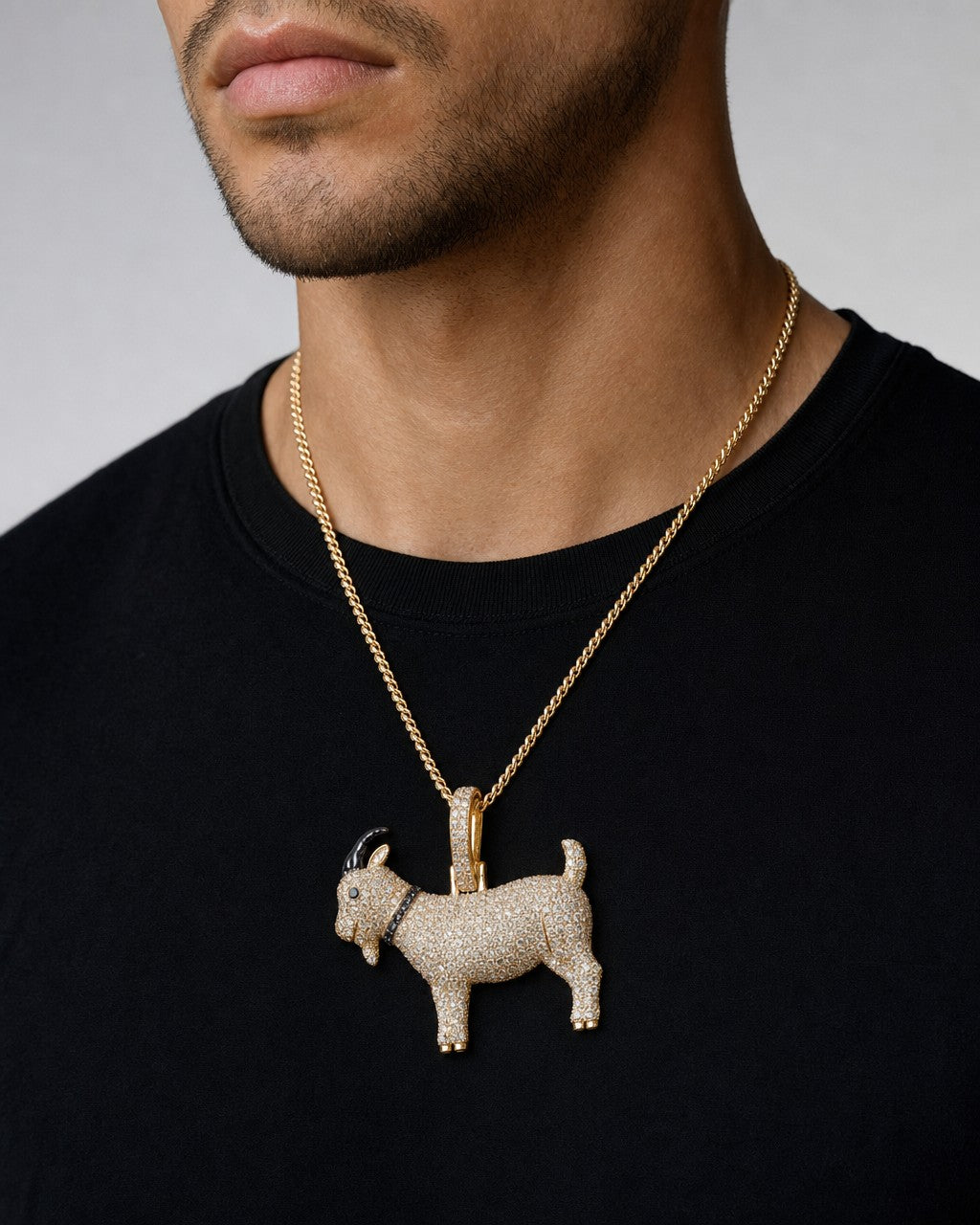 Male model wearing 14K GOAT Diamond Pendant