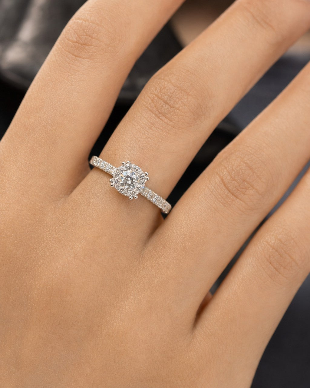 Female model wearing 14K Rosebud Halo Diamond Engagement Ring