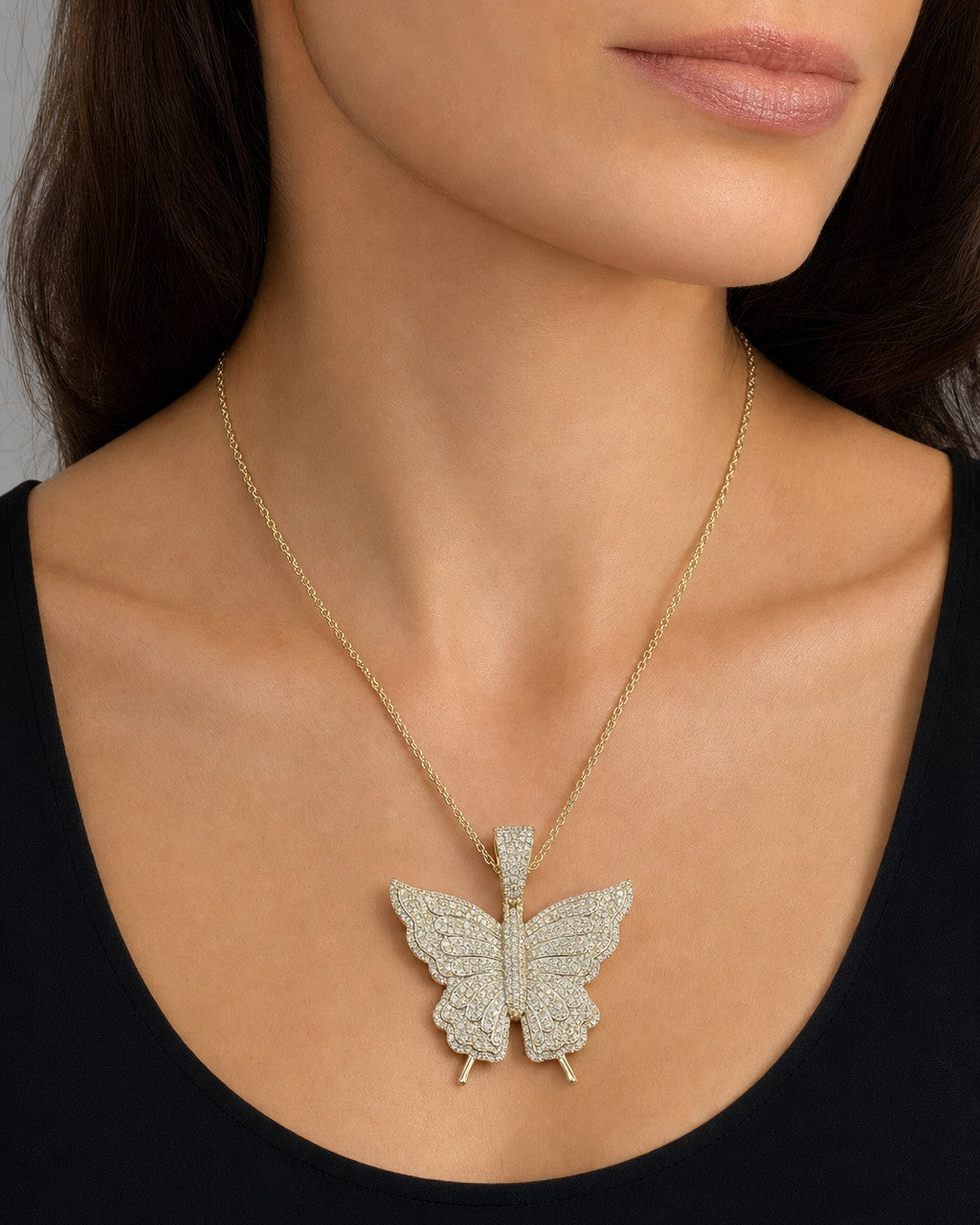 Female model wearing 14K Jumbo Butterfly Diamond Pendant
