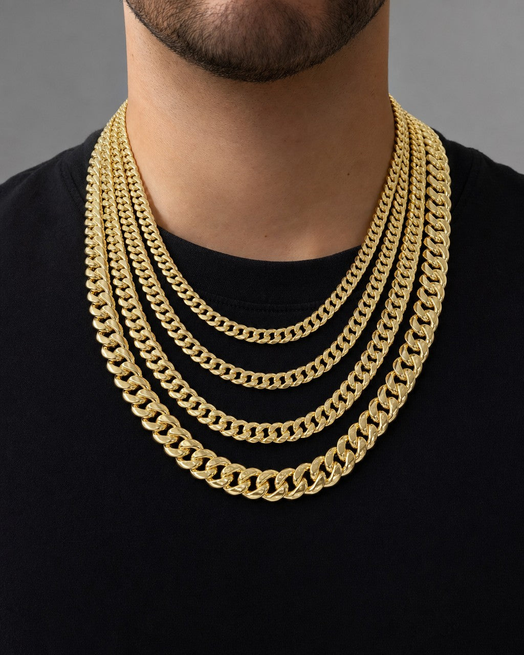 Male model wearing 14K Semi-Solid Cuban Link Chains 22-24"