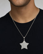 Male model wearing 10K Cosmic Star Diamond Pendant