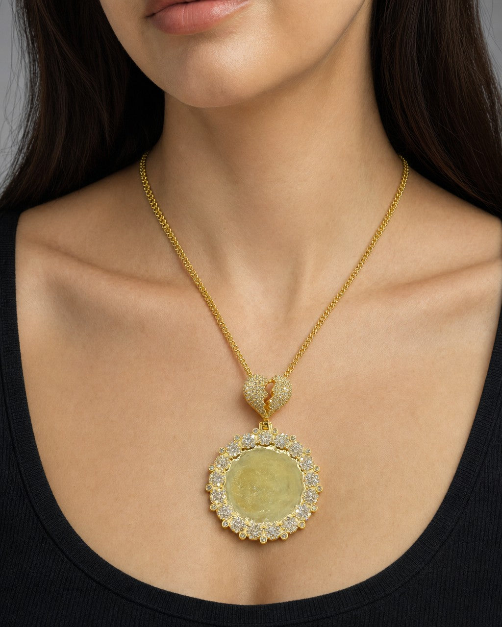 Female model wearing 10K Broken Heart Circle Photo Diamond Pendant