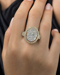 Female model wearing 14K Vanity Oval Halo Diamond Ring