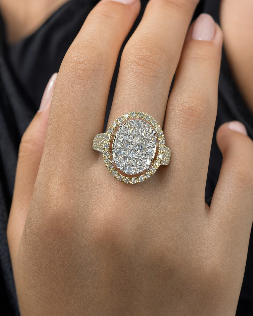Female model wearing 14K Vanity Oval Halo Diamond Ring