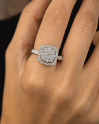 Female model wearing 14K Primrose Circle Square Halo Diamond Ring