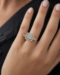 Female model wearing 14K Circle Square Halo Diamond Ring
