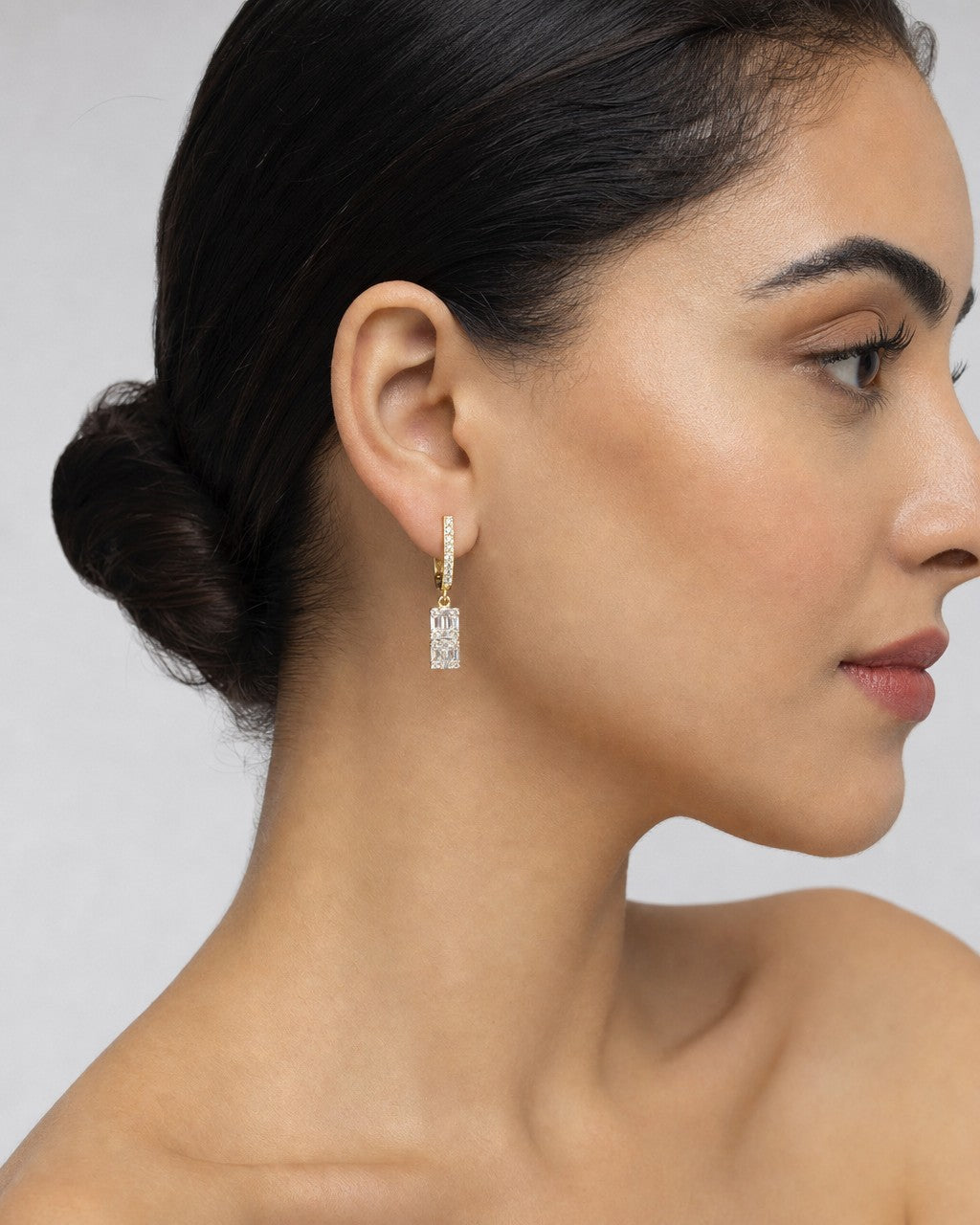 Female model wearing 14K Rococo Diamond Baguette Dangling Earrings